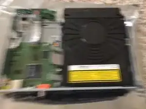 Remove the two screws holding down the drive, and you can now (kinda) remove it.