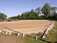 Riding arena leisure=pitch sport=equestrian surface=sand