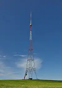 A radio tower insulated against ground used as tower radiator for medium wave