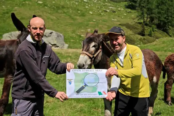 Two people (and some donkeys) at the "Dal gps alla montagna" Mapping Party, an event in the mountains of Trentino, Italy.