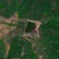 4/6 Dam (waterway=dam) holding back water from a reservoir (Maxar satellite imagery).
