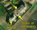 5/7 City centre concentrating a mural (tourism=artwork and artwork_type=mural), a tower of immortality (historic=memorial and memorial=immortality_tower), with its shadow cast on the ground, and a city hall (amenity=townhall) (Maxar satellite imagery)