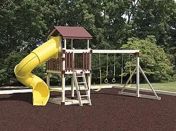 A platform with a ladder and a slide. Some swings are also connected to it.