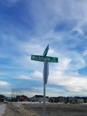 A street name sign showing an alternate grid based name