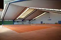 Indoor tennis court leisure=pitch sport=tennis surface=carpet indoor=yes (each court one pitch)