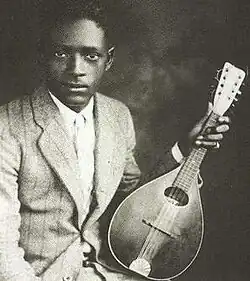 McCoy with his mandolin