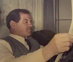 Şakir Bayhan reading newspaper