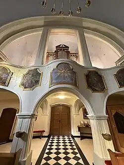 The choir and choir parapet painted with scenes from the life of St. Isidore