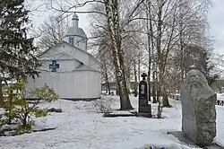 Grave of Kyrylo Stetsenko near the wooden church in Vepryk