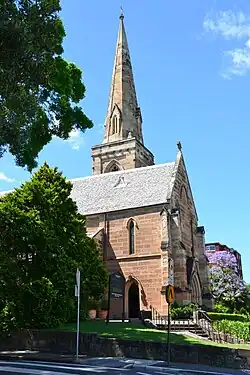 The east end of St Mark's showing simple untraceried lancet windows, and the spire rising from a square-topped tower without pinnacles or broaches.
