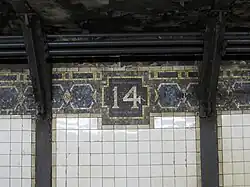IRT mosaic trim line and frieze with number "14"