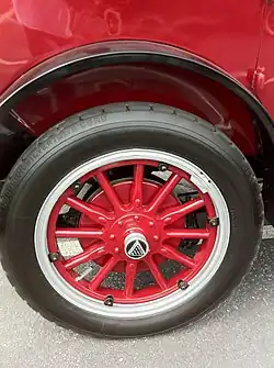 Center small hubcap with automaker's logo