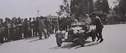 Black-and-white photograph of the Maserati 4CS 1100 being driven on the right, a 1936 car raced by Ettore Bianco and M. Boccali
