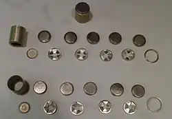 Three battery packs for the 1PN51-2, two of which are disassembled