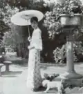 Empress Consort Wanrong in the Zhang Garden with her dog