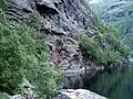 Nesbøgalden built by use of dynamite in the rock face above Nesbøvatnet lake.