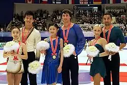 The pairs event medalists at the 2011 NHK Trophy
