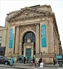 The front facade with banners for the Museum of Illusions (2020)