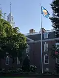 The Delaware flag flying at the Delaware Legislative Hall.