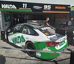 Gaetano Di Mauro's green and white car, in an outdoors environment