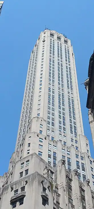 View of 20 Exchange Place's upper stories from below. The facade is made of stone.