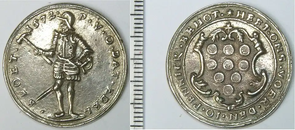 Two sides of a silver token