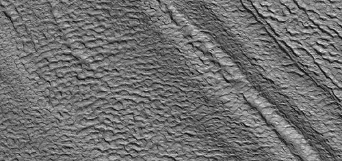 Close view of concentric crater fill, as seen by HiRISE under HiWish program Concentric crater fill (CCF) is considered to be glacier-like in that it has ice below and thin layer of debris. The debris layer prevents the ice from escaping into the air.