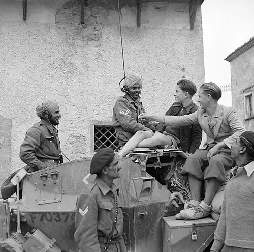 Indian Armoured Corps chat with civilians in San Felice during advance towards Sangro