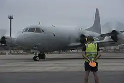 Colour photograph of a four engined aircraft on the ground