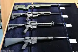 From top to bottom: a .338 Lapua Magnum Sako TRG-42, .308 Winchester MR308, .223 Remington Schmeisser GmbH AR15 M5 and a 9&nbsp;mm AR-15 on display at the 2012 ARMS & Hunting exhibition.