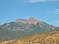 Little Tuk (left) and Mt. Tukuhnikivatz (right) of the La Sal Range in summer, seen from the south.
