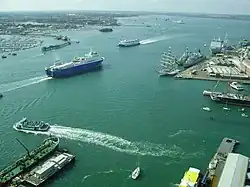 A view of various ferries, cargo and military vessels moving out of Portsmouth Harbour. This photograph was taken from the viewing deck of the Spinnaker Tower.