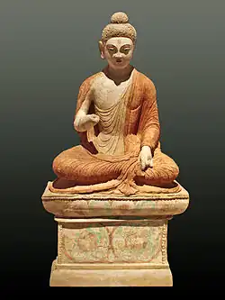 A statue depicting Buddha giving a sermon, from Sarnath, 3,000&nbsp;km (1,864&nbsp;mi) southwest of Urumqi, Xinjiang, 8th century