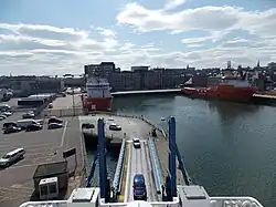 Cars drive onto ferry