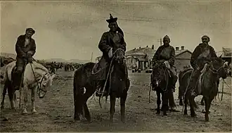 Mongol horsemen on the streets of Urga in 1920.
