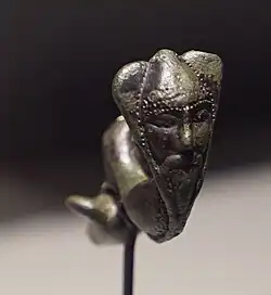 A copper fibula from Gué de la Marne, Musée d'Épernay [fr].
