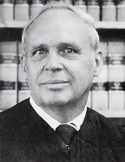 Black and white head and shoulders photo of Judge Albert W. Coffrin in judicial robes