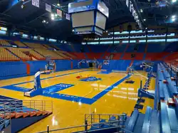 Image 16Naismith Court at Allen Fieldhouse in Lawrence, Kansas in 2021. The Kansas Jayhawks are among the most storied and historic programs at the collegiate level, due to their ties to James Naismith, the inventor of basketball (from College basketball)