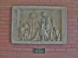 Panel from original Gallaudet monument (1854) depicting Thomas Hopkins Gallaudet teaching children the manual alphabet