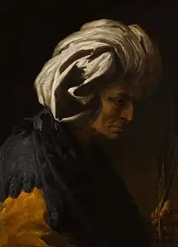 An old woman in a white turban and feathered cape, oil on canvas, priv. col.