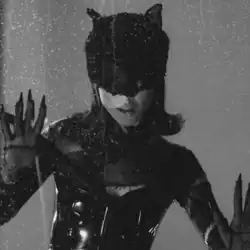 A black and white picture of Ariana Grande dressed as Catwoman.