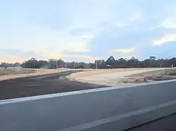 Looking west towards the construction of the Armadale Road and Liddelow Road intersection upgrade in Banjup, Western Australia
