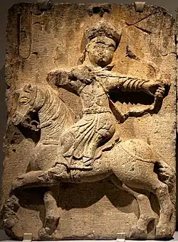 Amir Hasan II (letters ԱՄՐ ՀՍ "AMR HS") hunting on horseback in Mongol attire, Church of the White Virgin (completed 1321). History Museum of Armenia, Yerevan.[30][22]