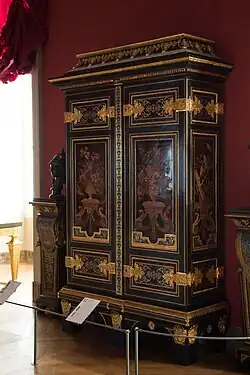 Baroque cupboard; by André Charles Boulle; c.1700; ebony and amaranth veneering, polychrome woods, brass, tin, shell, and horn marquetry on an oak frame, gilt-bronze; 255.5 x 157.5&nbsp;cm; Louvre[57]