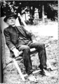 Black and white photograph of Arthur Corlette seated.