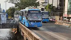 Corridor 8 bus fleet entering Harmoni, 2022