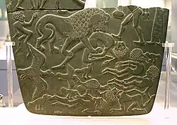 Image 18Possible prisoners and wounded men of the Buto-Maadi culture devoured by animals, while one is led by a man in long dress, probably an Egyptian official (fragment, top right corner). Battlefield Palette. (from Prehistoric Egypt)