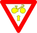 B23: Bike may pass a yellow or red light to go straight, after yield