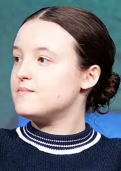 Bella Ramsey looking to the left