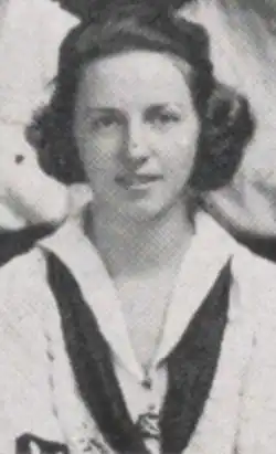 A young white woman with dark hair, wearing a middy blouse